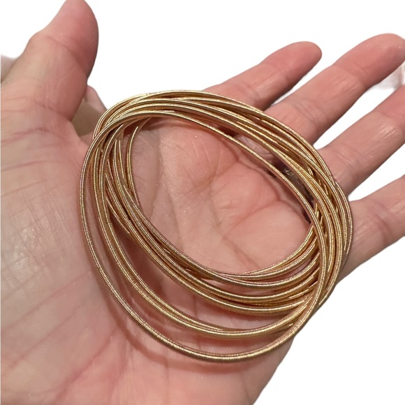 Set of Gold Stretchy Spring Bracelets - Picture 3 of 3